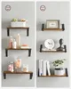 Two arrangements of wall shelves are displayed against a light gray background, showcasing different decorative items and bathroom essentials. Náhled obrázku produktu