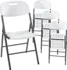 Four white folding chairs are arranged in a staggered formation against a white background. Podgląd zdjęcia produktu