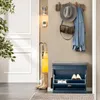 An entryway scene with a shoe cabinet, boots, and umbrellas. Náhled obrázku produktu