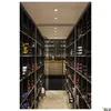 A long, narrow wine cellar with shelves filled with wine bottles, a bar area in the background, and ceiling lights. Produktbild-Vorschau