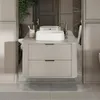 A modern bathroom vanity with a sink and faucet, reflected in a mirror. Anteprima dell’immagine prodotto