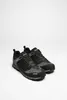 A pair of black and gray hiking shoes with red accents, presented on a white background. Voir les images du produit