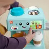 A child's hands are interacting with a toy coffee maker. Náhľad obrázku produktu
