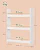 A diagram illustrating the dimensions and weight capacity of a white bookshelf with wooden bars. Náhled obrázku produktu