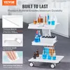 A white three-tier laboratory cart with various beakers, test tubes, and bottles on its shelves, set against a light gray and white background. Produktbild-Vorschau