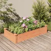 A wooden raised garden bed filled with plants and flowers, placed on a wooden deck. Podgląd zdjęcia produktu