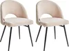 Two beige bouclé chairs with black metal legs are shown against a white background. Náhled obrázku produktu