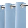 Close-up of light blue curtains with metal grommets hanging on a curtain rod. Produktbild-Vorschau