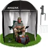 An older man sits in a chair inside a fishing shelter, preparing fishing gear. Anteprima dell’immagine prodotto