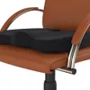 A close-up shot of a black seat cushion placed on a brown leather office chair. Náhľad obrázku produktu