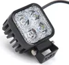 A close-up studio shot of a square LED work light with a black housing and a metal mounting bracket. Produktbild-Vorschau