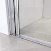 A close-up view of the bottom corner of a shower enclosure, showing the track and frame on a tiled floor. Anteprima dell’immagine prodotto