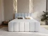 A modern bedroom with a large boxspring bed as the focal point. Produktbild-Vorschau