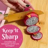 A hand is slicing a dragon fruit on a wooden cutting board, with text overlays. Produktbild-Vorschau