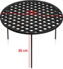 A black metal round grill grate with three legs, shown from a slightly elevated side angle against a white background. Red lines indicate measurements for diameter and height. Produktbild-Vorschau