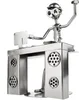 A metallic figurine of a DJ at a DJ booth with a computer. Náhľad obrázku produktu