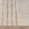 A close-up view of a beige rug with vertical stripes. Anteprima dell’immagine prodotto