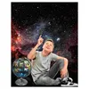 A young boy is sitting on the floor, looking up at a starry sky, with a globe next to him. Náhľad obrázku produktu