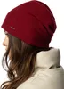 A woman wearing a burgundy beanie and a cream-colored jacket, shown from the side. Produktbild-Vorschau