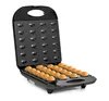 An open waffle maker with freshly baked waffle halves inside. Anteprima dell’immagine prodotto