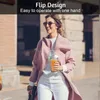 A woman walks down a street holding a portable blender. Produktbild-Vorschau