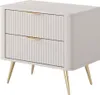 A beige nightstand with gold accents and fluted drawers sits on a white background. Produktbild-Vorschau