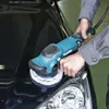 A person is using a car polisher on the hood of a black car. Podgląd zdjęcia produktu