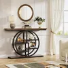 A console table with a circular shelf unit is displayed in a well-lit room with a window and curtains. Anteprima dell’immagine prodotto
