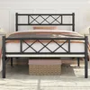 A black metal bed frame with a diamond pattern on the headboard and footboard, shown with bedding and a storage basket underneath. Podgląd zdjęcia produktu