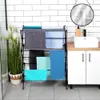 A bathroom scene with a towel rack, sink, and vanity. Anteprima dell’immagine prodotto