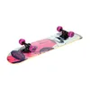A skateboard with a colorful graphic design is shown against a white background. Voir les images du produit