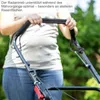 A person is using a lawnmower in an outdoor setting. Produktbild-Vorschau