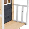 Close-up view of a wooden playhouse door and railing. Náhled obrázku produktu