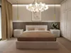 A bedroom with a bed, nightstands, and a wardrobe. Produktbild-Vorschau
