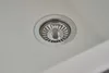 A close-up view of a sink drain with a strainer. Produktbild-Vorschau