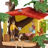A toy treehouse scene with two children, a dog, and a squirrel. Anteprima dell’immagine prodotto