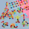 A collection of magnetic building blocks assembled into various shapes and figures, including numbers, animals, and abstract designs. Voir les images du produit