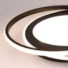 A close-up, angled view of a modern, black, circular LED ceiling light with a white light strip. Náhled obrázku produktu