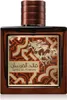A close-up studio shot of a perfume bottle with ornate detailing. Voir les images du produit