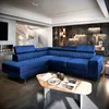 A modern living room with a blue sectional sofa. Produktbild-Vorschau