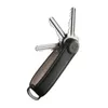 A black leather key organizer with silver keys extended from it, set against a white background. Produktbild-Vorschau