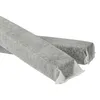Two charcoal filters wrapped in gray non-woven fabric, presented diagonally on a white background. Produktbild-Vorschau