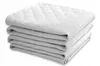 A stack of folded white towels on a white background. Produktbild-Vorschau