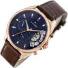 A close-up, angled shot of a Tommy Hilfiger watch with a blue face and a brown leather strap. Produktbild-Vorschau