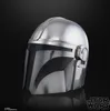 A close-up studio shot of a silver Mandalorian helmet against a black background. Voir les images du produit