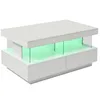A modern white coffee table with LED lighting and glass accents. Voir les images du produit