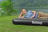 A woman lying on an inflatable mattress by a lake. Náhled obrázku produktu