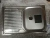 A stainless steel sink with a drainboard is shown from a top-down perspective. Podgląd zdjęcia produktu