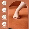 A hand pressing into an orange upholstered surface, with icons and text describing product features on the left. Náhled obrázku produktu