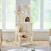 A cat tree with multiple levels and platforms, occupied by three cats, placed in a room with a large window showing greenery outside. Podgląd zdjęcia produktu